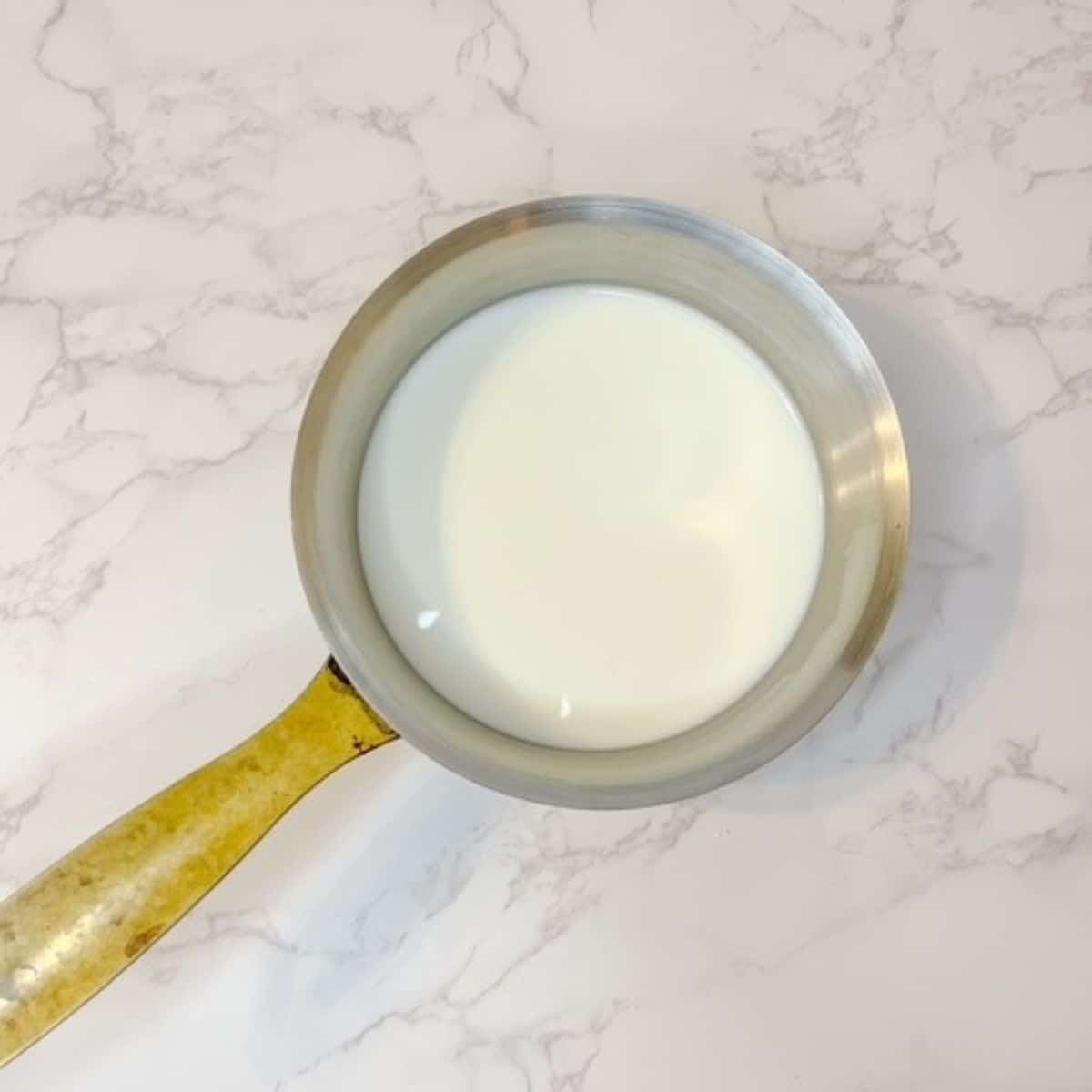 add milk, sugar, and salt to a saucepan