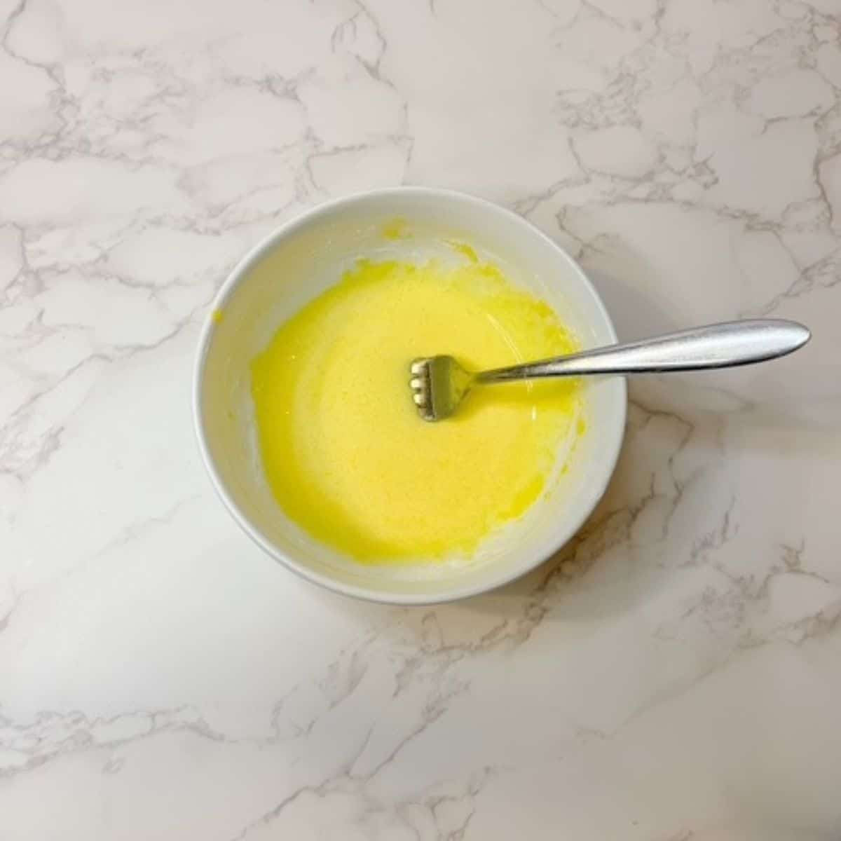 whisk the egg yolks until smooth and light in color