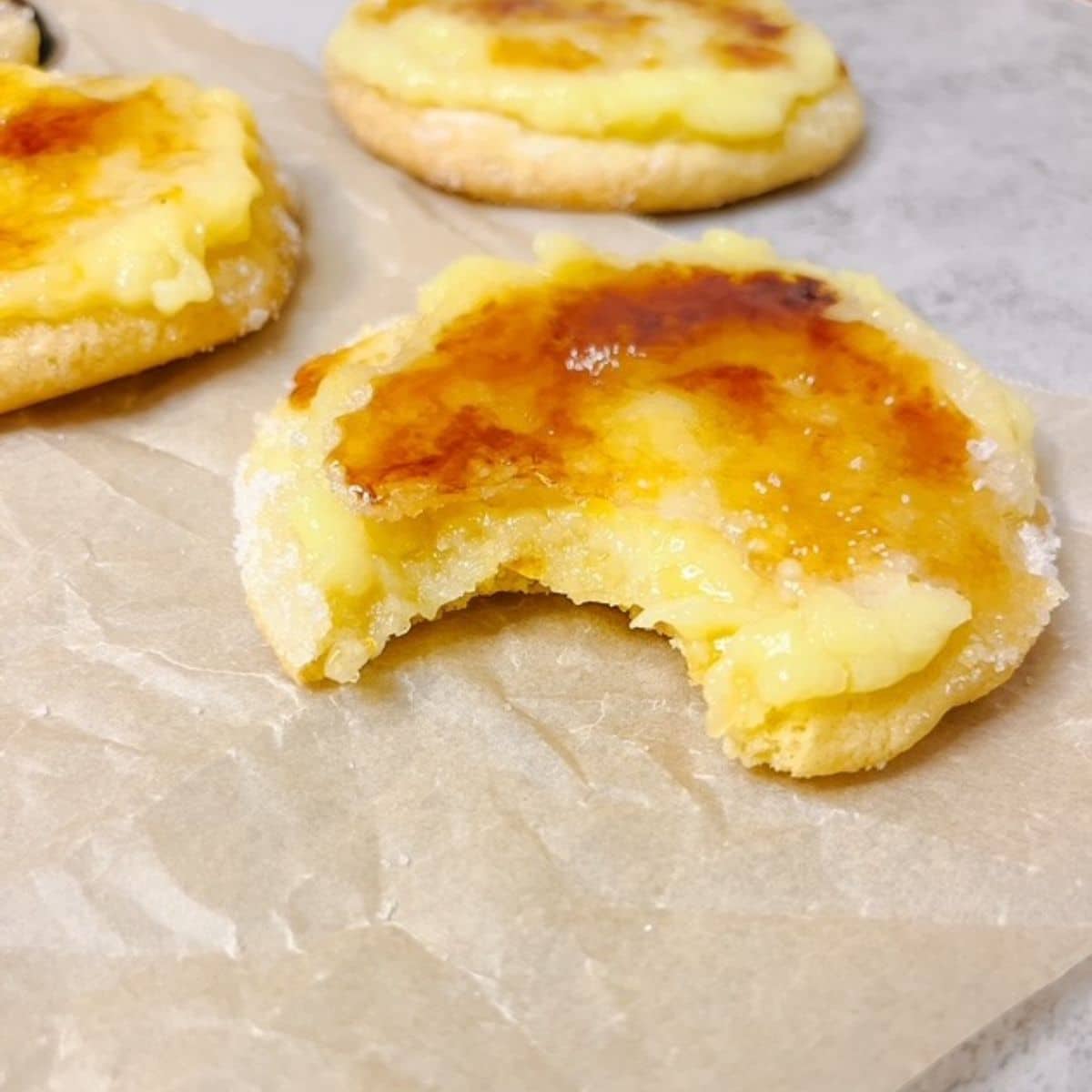 creme brulee cookie with a bite out of one