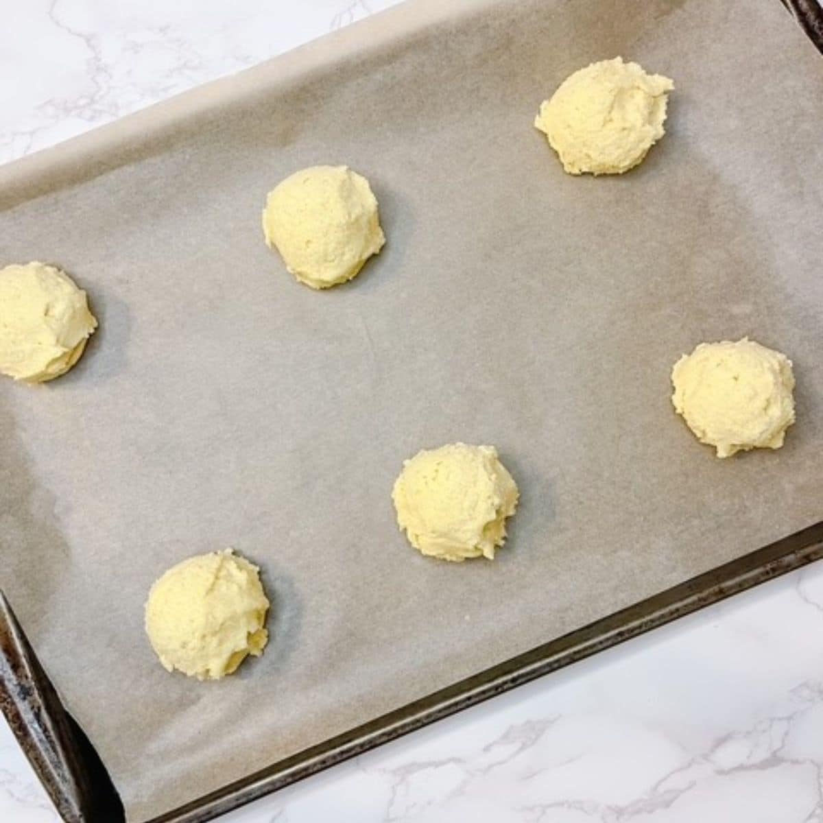 Roll cookies into tablespoon sized balls