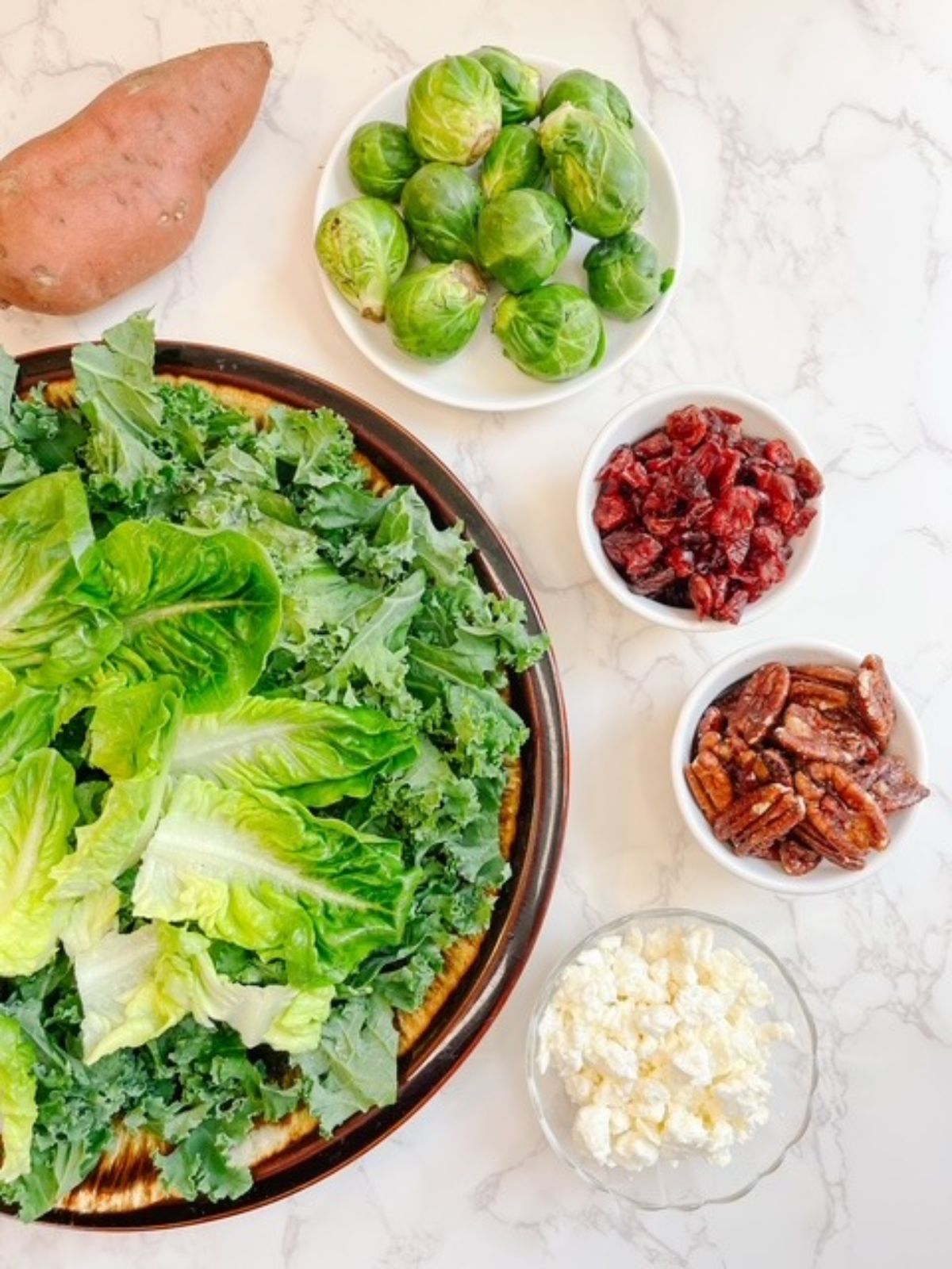 sweet potato, brussels sprouts, craisins, pecans, feta, kale and lettuce