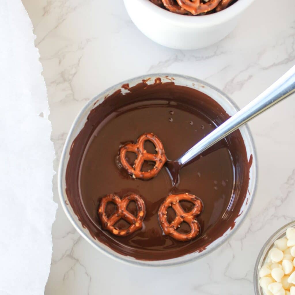 Dip mini pretzels in the melted dark chocolate.