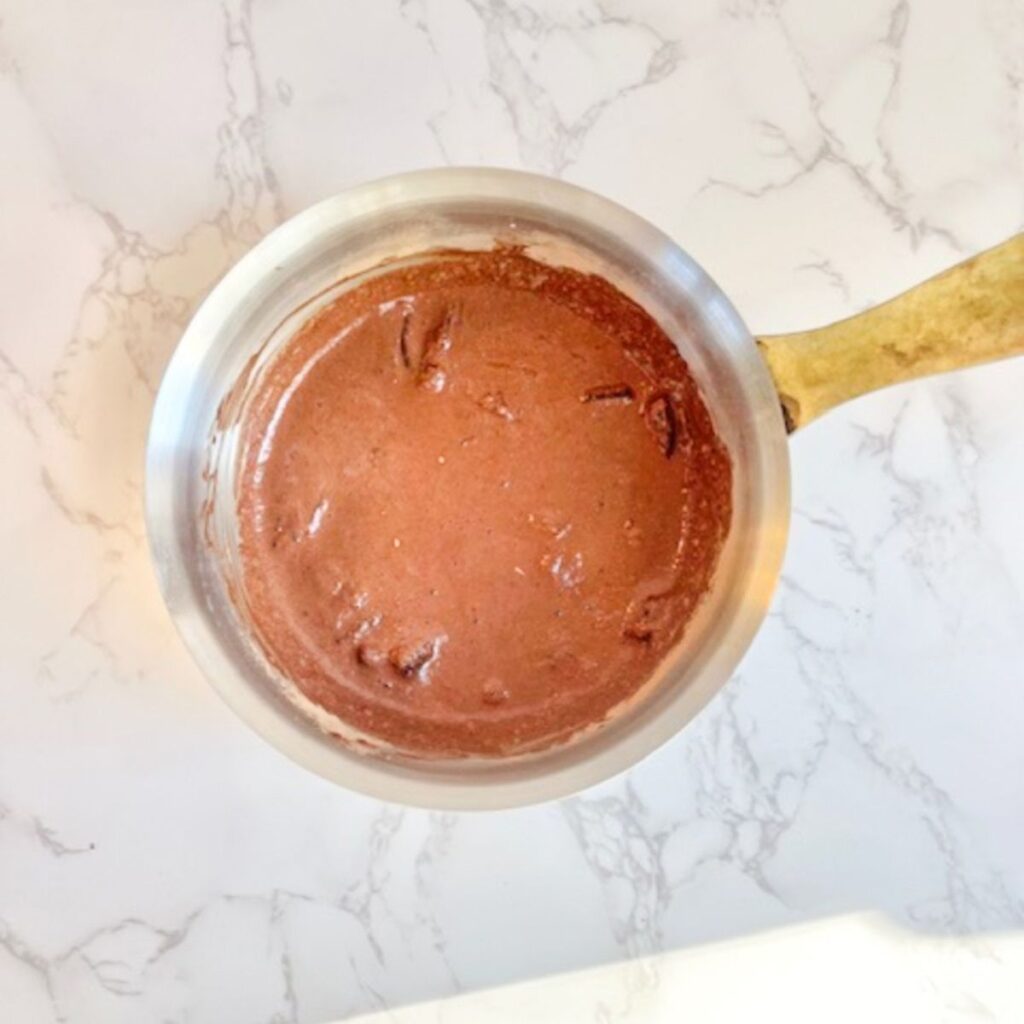 Whisk together the ingredients in a medium bowl over the stove until melted.