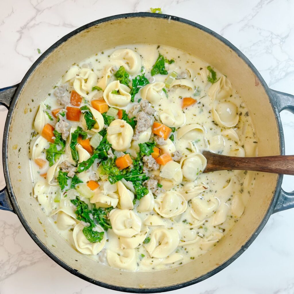 Cook the tortellini soup in a large dutch oven.