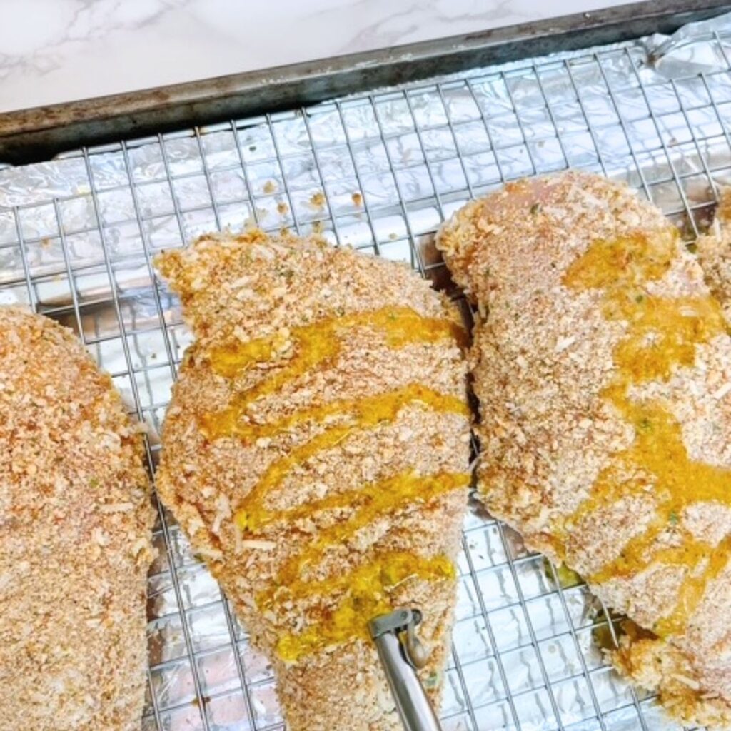 Drizzle the chicken breast with a bit of olive oil.