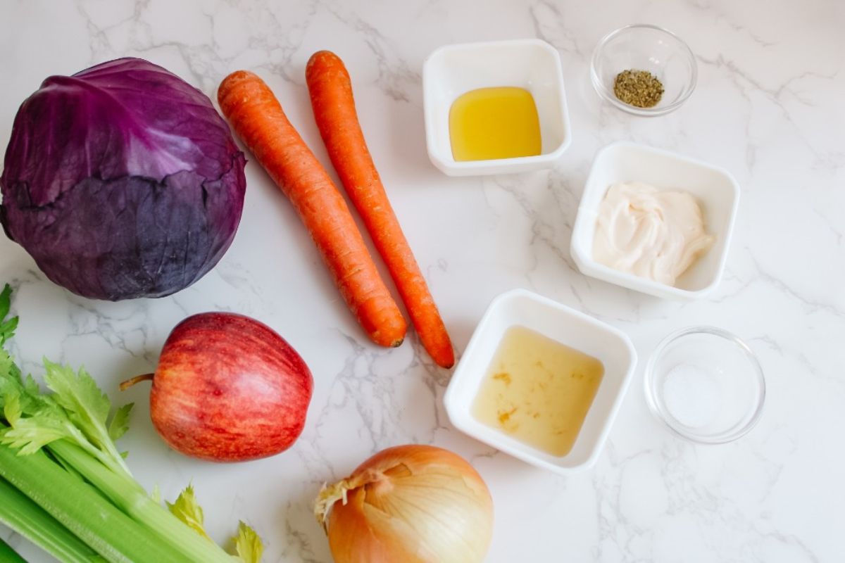 Red cabbage, carrots, celery, apple, onion, ACV, honey, mayo, salt, and pepper