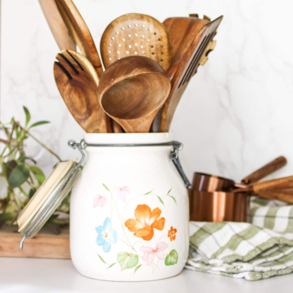Store wooden cooking utensils in a crock that sits on your kitchen counter.