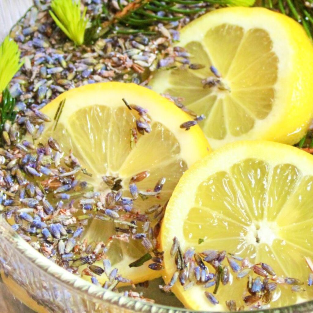 Add fresh lemon slices, dried lavender and pine to a simmer pot with water.