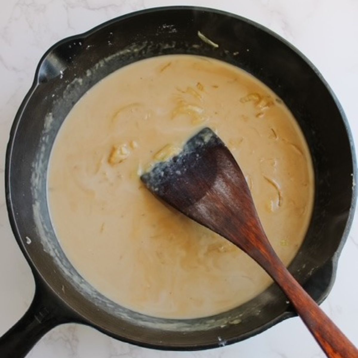 add in the heavy cream and the beef broth to the sauce