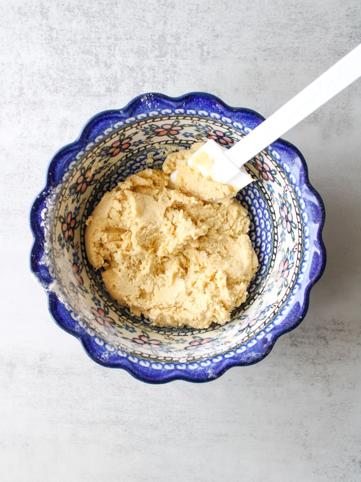 Mix in the dry ingredients until cookie dough forms.