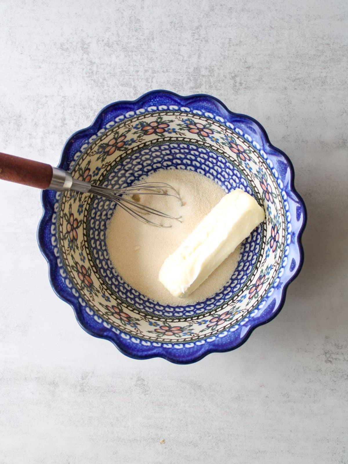 Add the butter and sugar to a large mixing bowl.