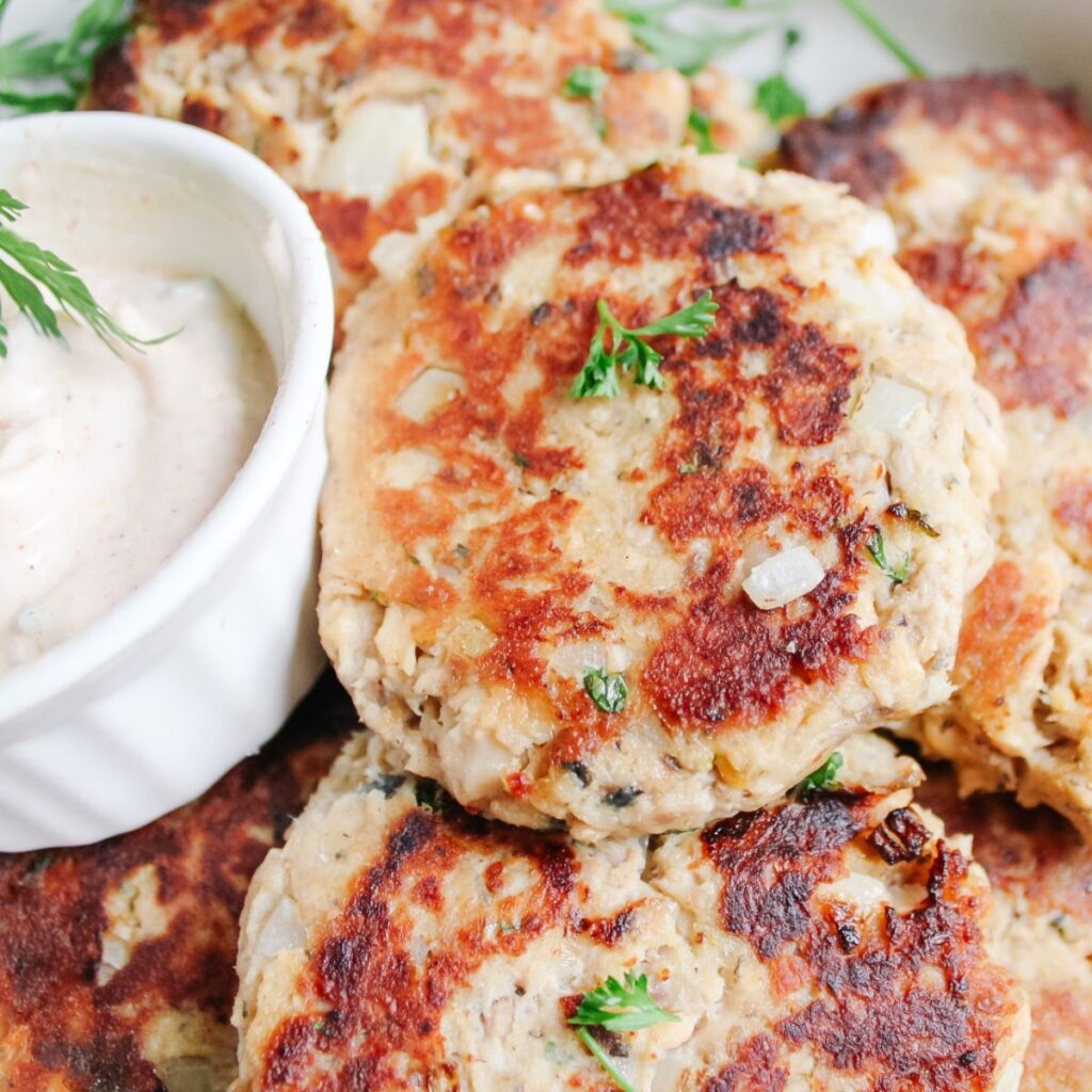 A close up view of a crispy salmon patty.