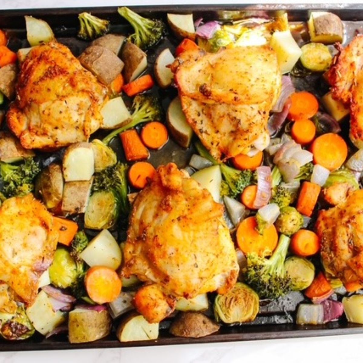 chicken and veggies sheet pan done baking