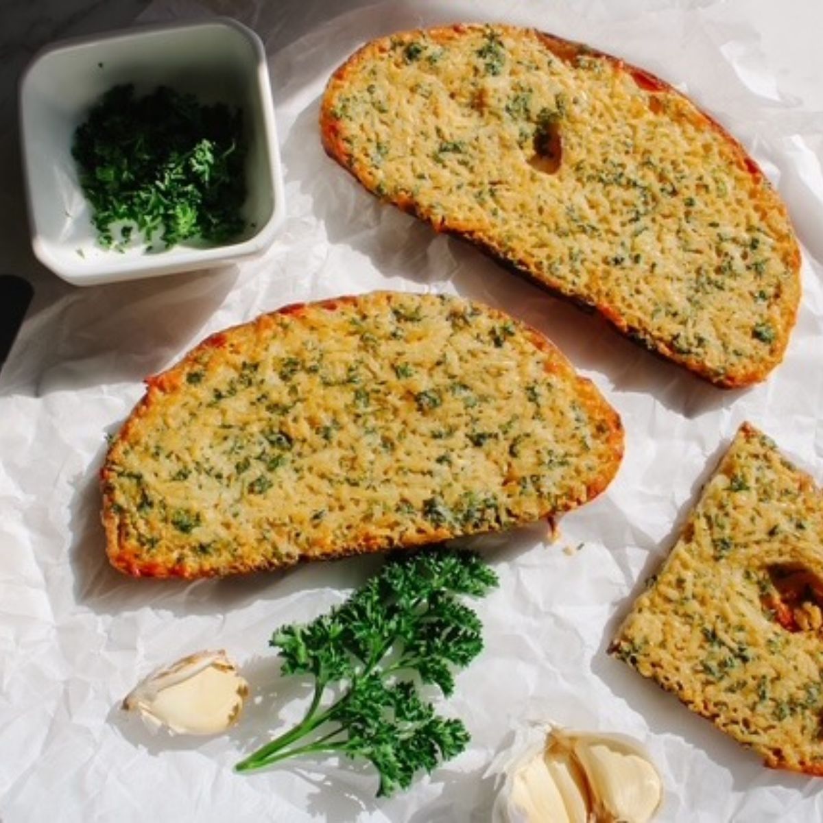 baked garlic bread on parchment