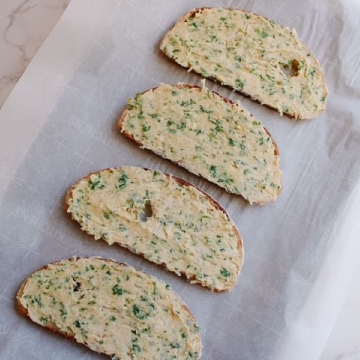 Place prepared bread on lined baking sheet
