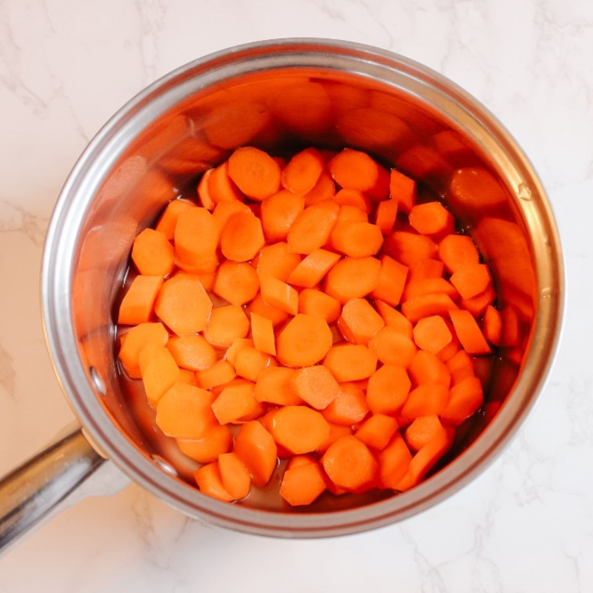 add carrots and water to a medium pot