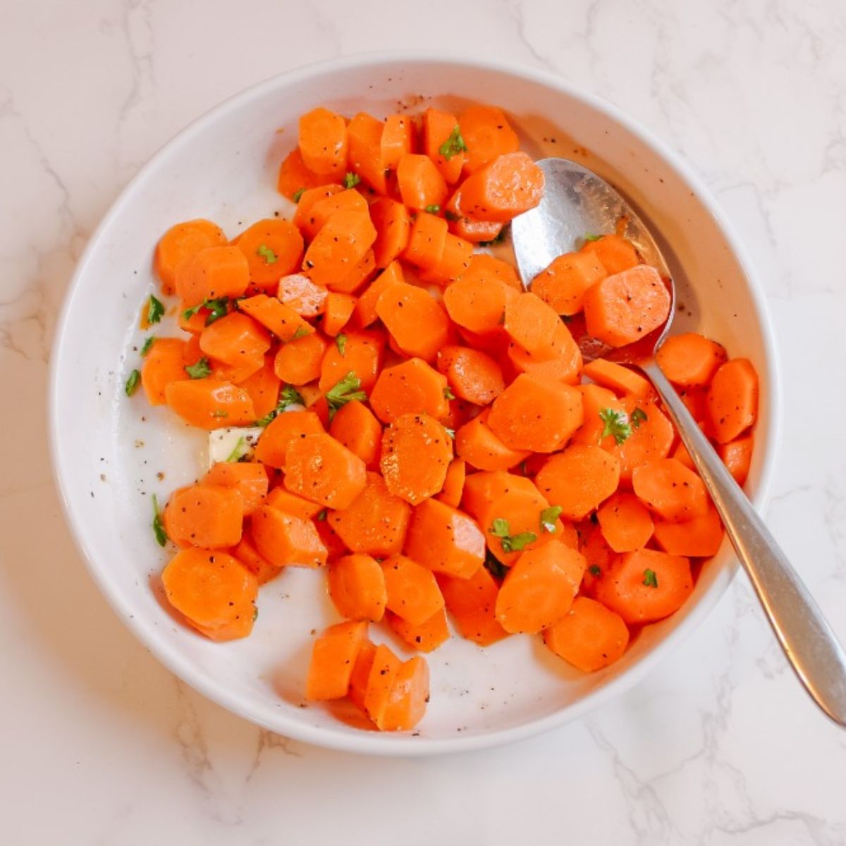 Add in butter, lemon, salt, pepper, and parsley to steamed carrots