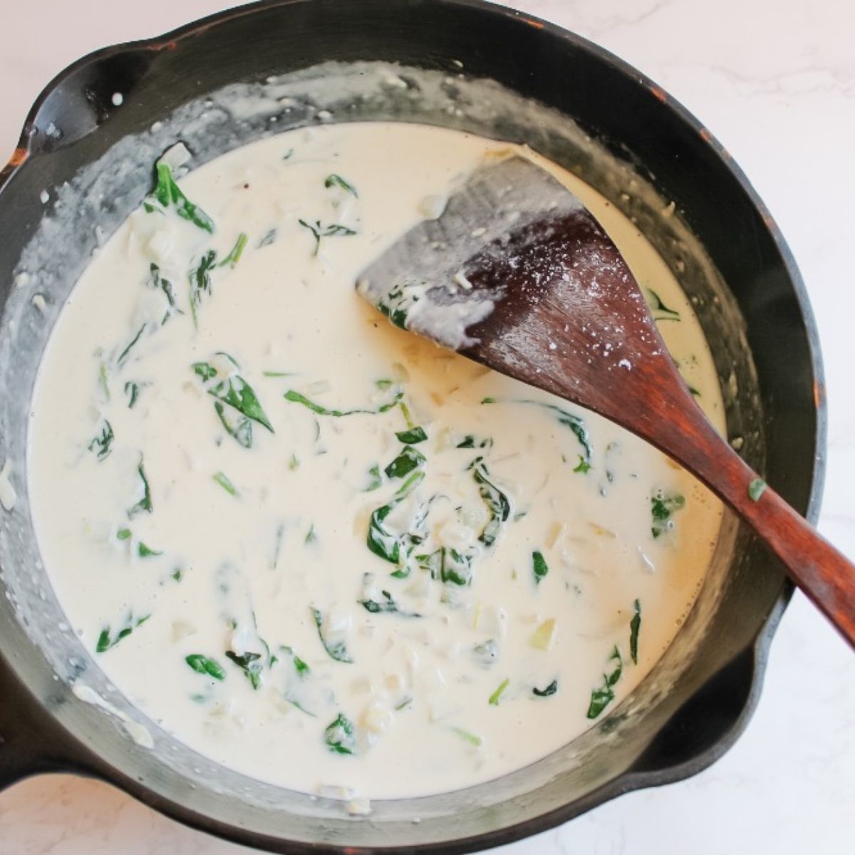 add spinach and parmesan cheese into sauce