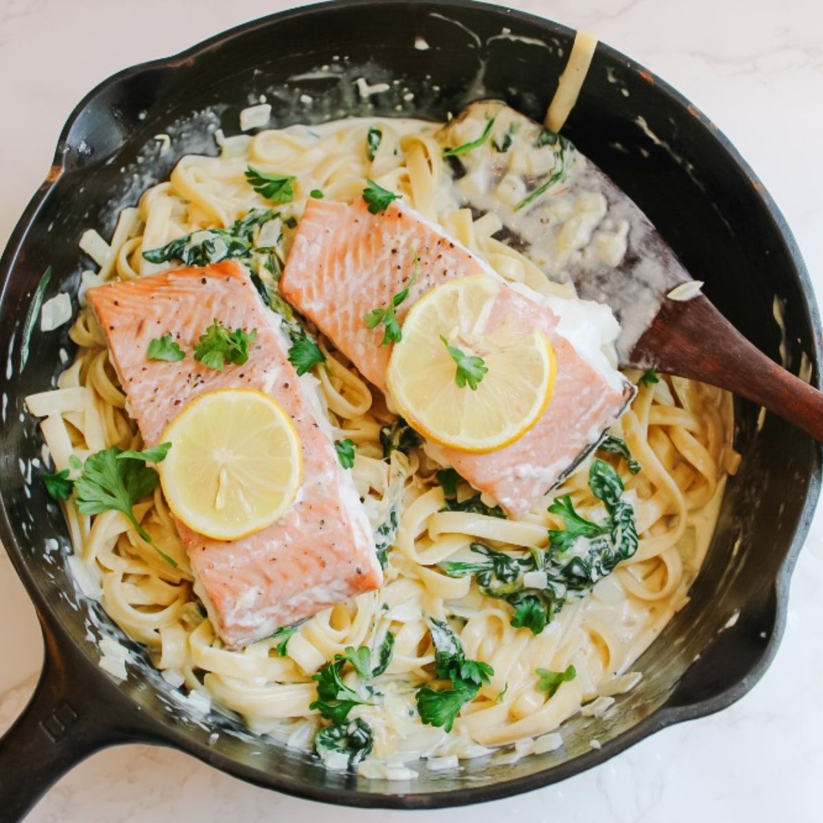 Add salmon on top of pasta
