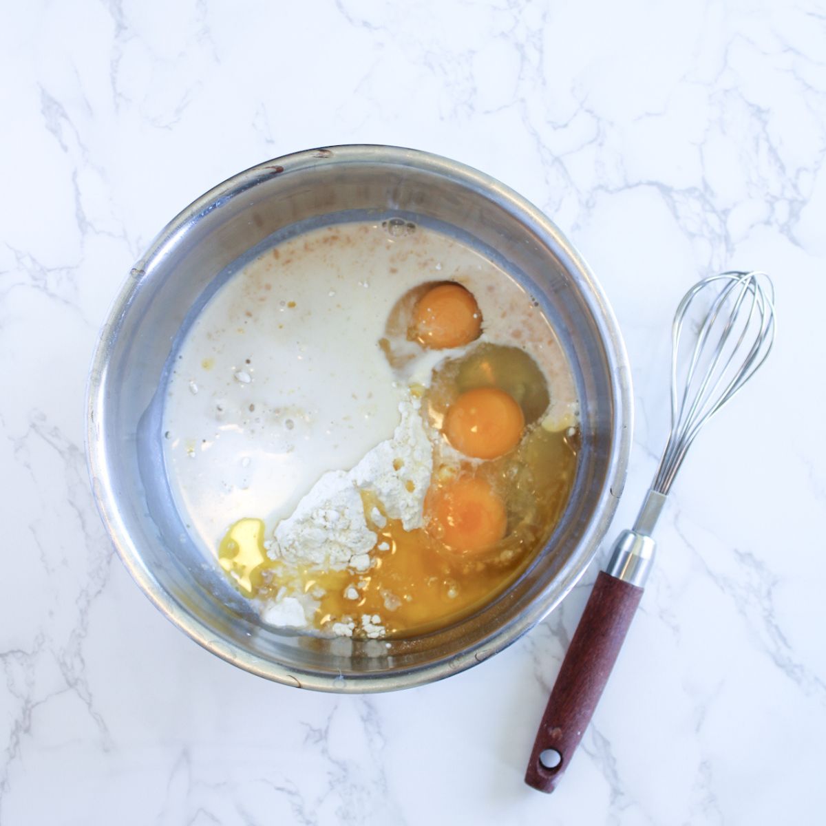 Add all of the crepe ingredients into a large mixing bowl.