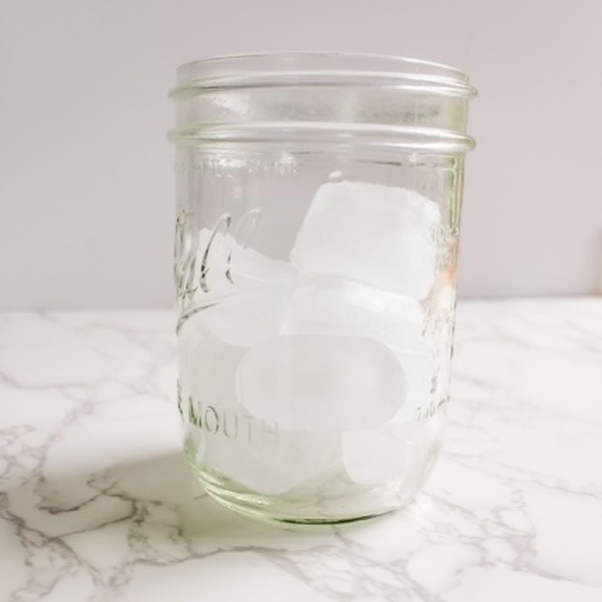 Add ice to a jar