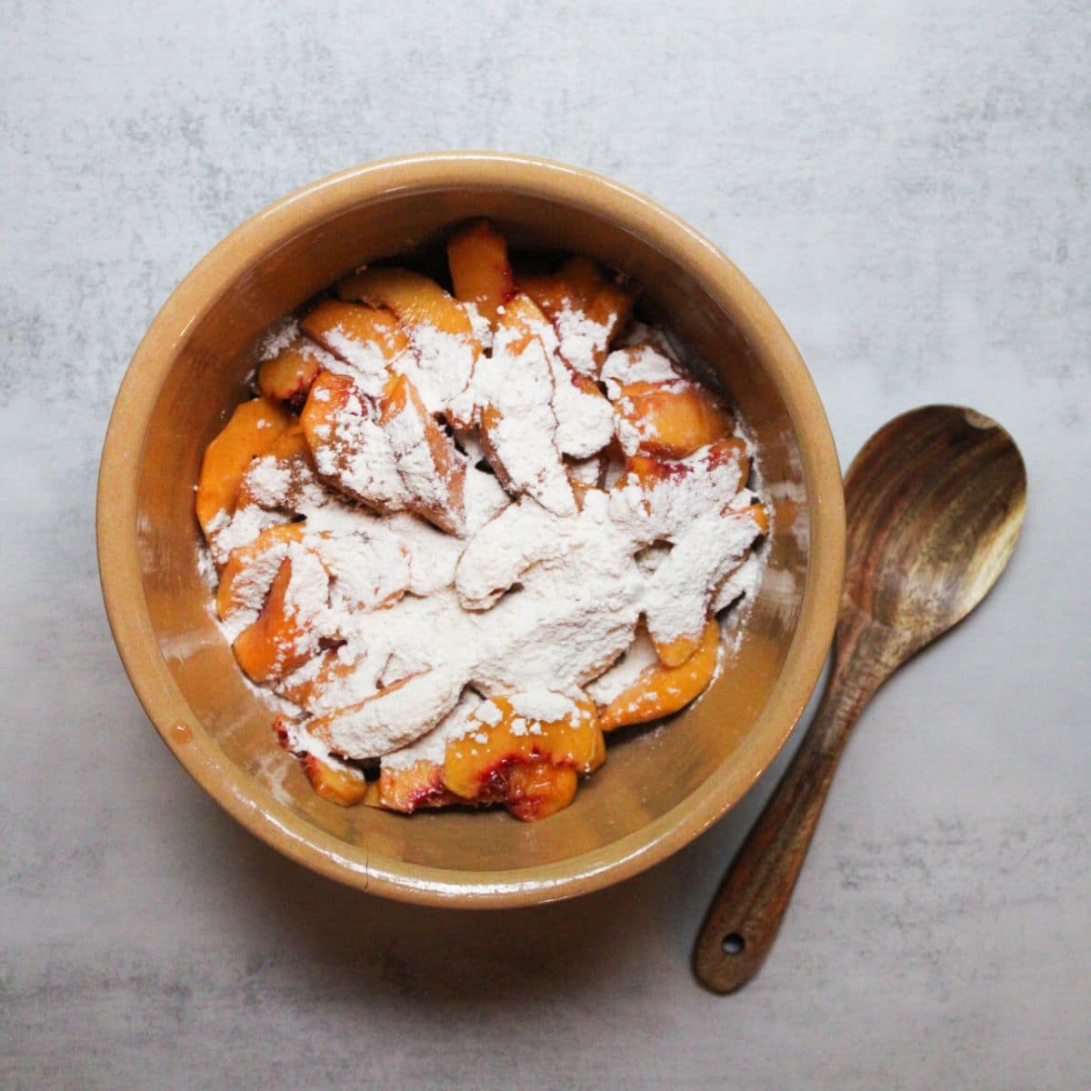 Mix all the peach crisp ingredients together in a large mixing bowl.