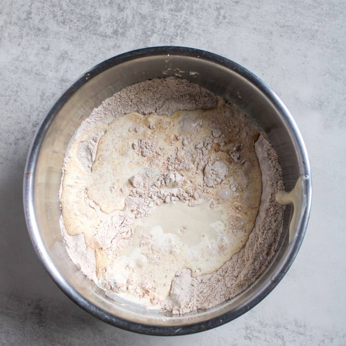 Add the wet ingredients into the dry ingredients in a large mixing bowl.