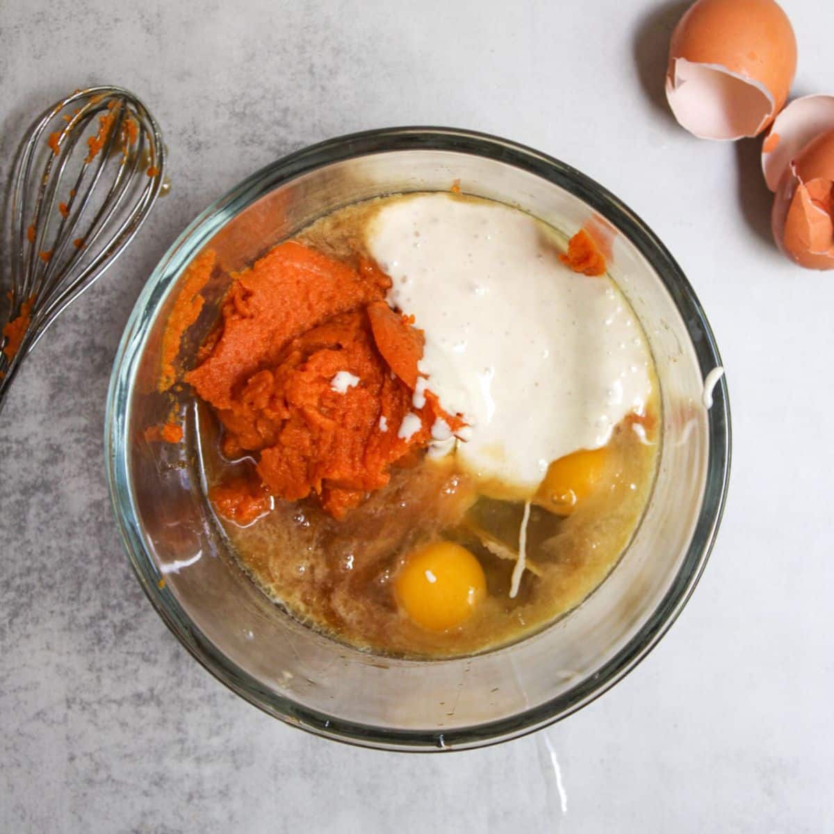 Add all of the sourdough pumpkin muffin wet ingredients to a large mixing bowl.