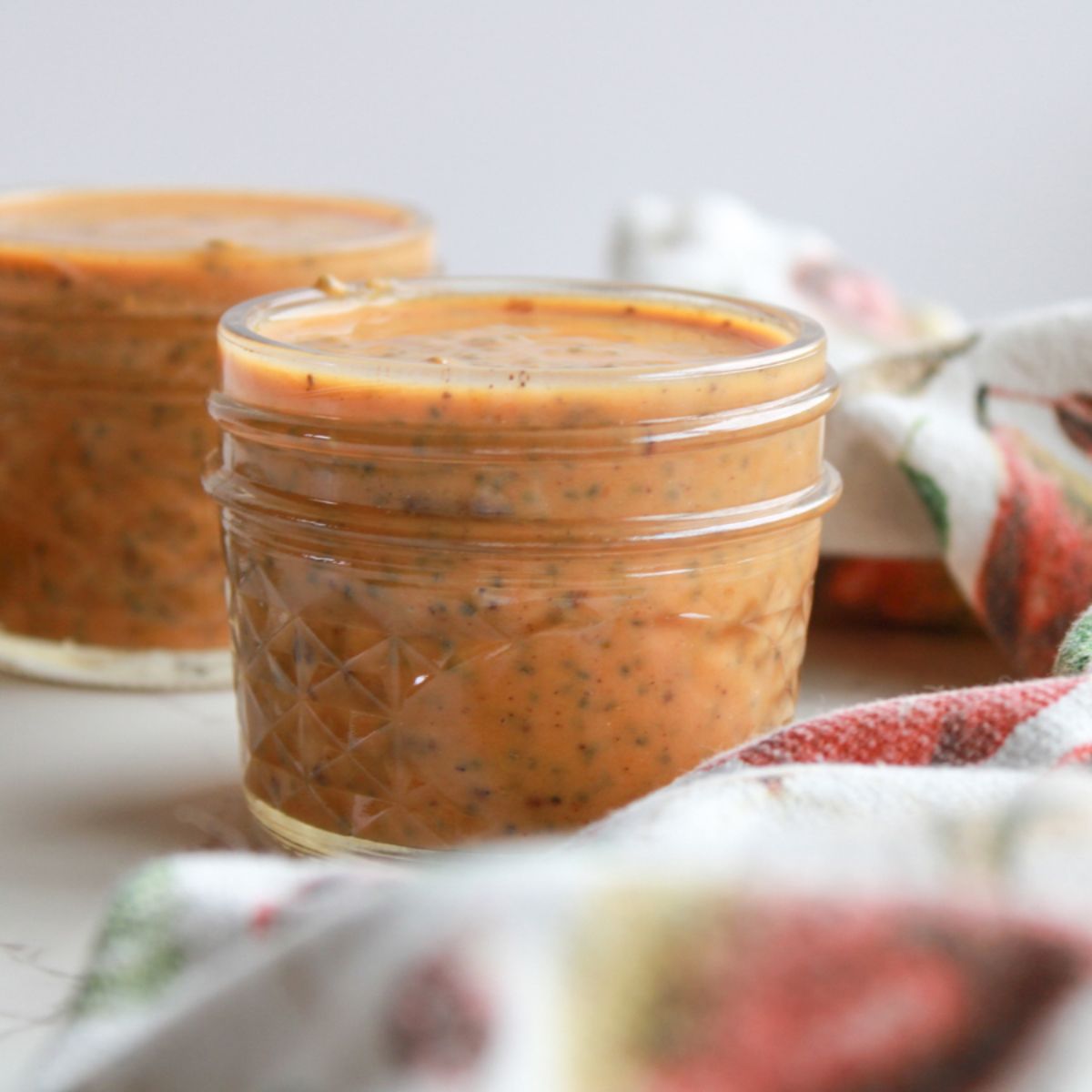 A small mason jar filled with orange chia pudding