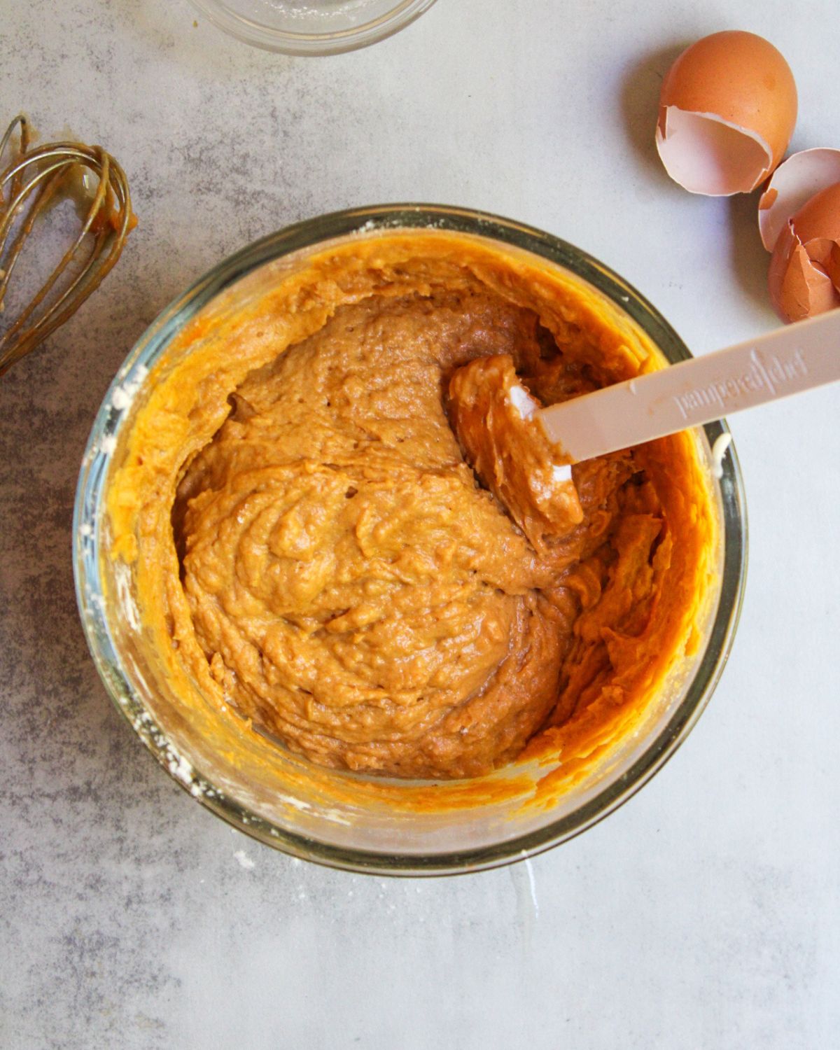 The muffin batter should be orange in color and thick. 