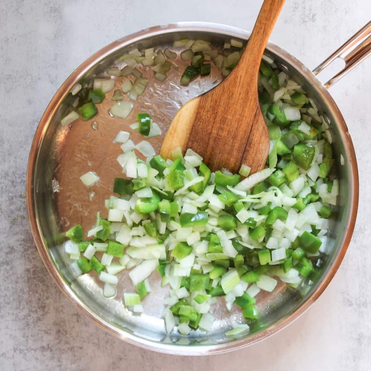 Sautee onion and green pepper until translucent.